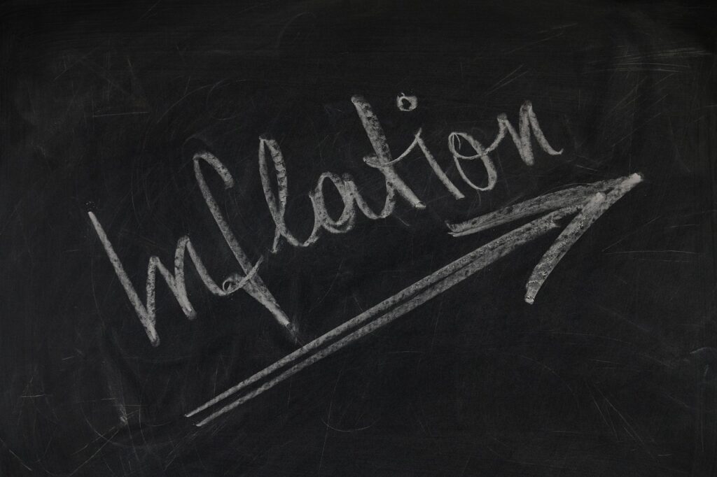 demystifying-inflation - blackboard with the word "inflation" and an upward-trending arrow