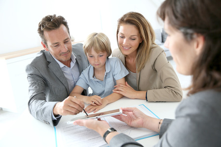 Digital signing - family signing home purchase contract on tablet