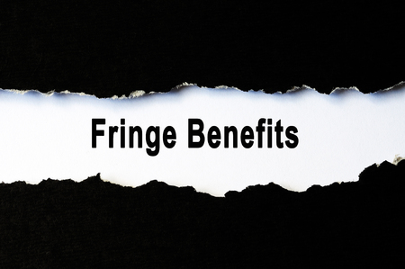 fringe benefits words under torn paper