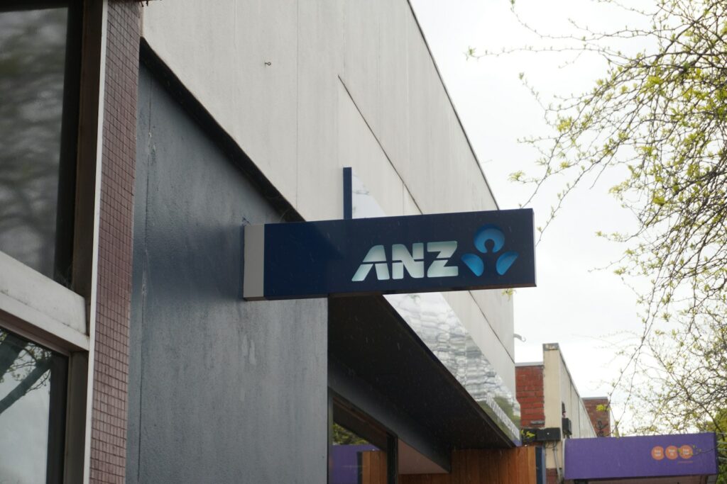 Business Update – 26 April 2024 - ANZ Bank sign hanging from the side of a building