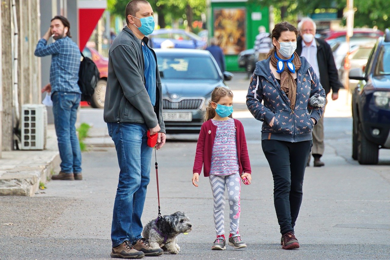 COVID-19 Business Update - 22 May 2020 - People walking in public wearing face masks.
