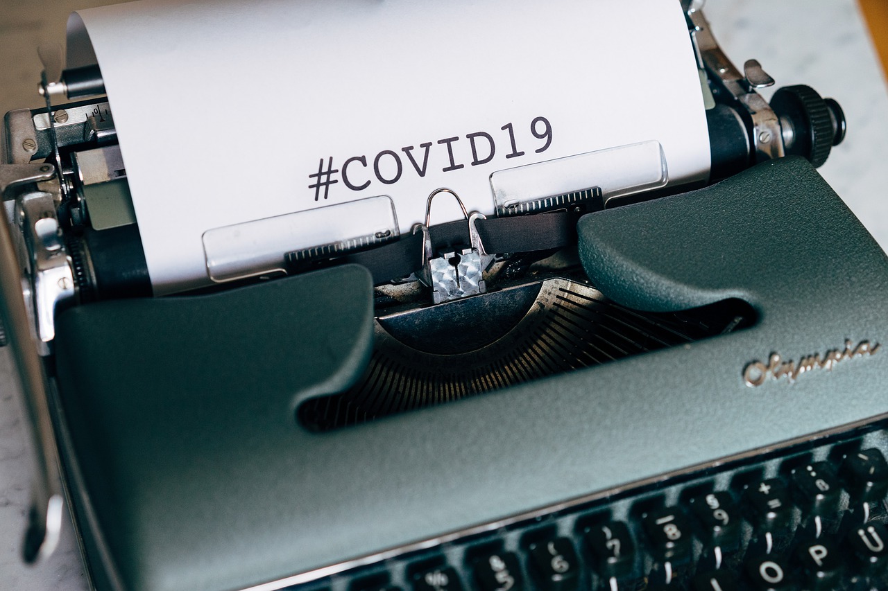 Covid-19 Business Update - 19 June 2020 - an old typewriter displaying the words hashtag COVID19