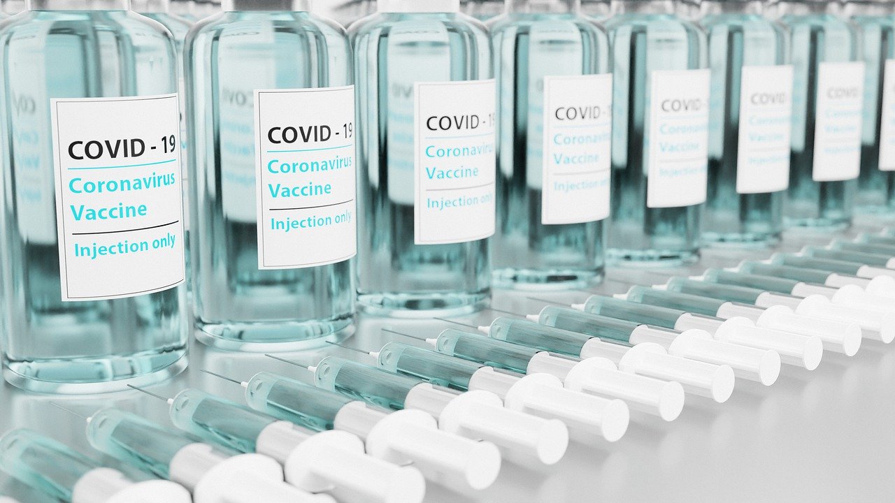 COVID-19 Business Update – 18 February 2021 - rows of bottles of COVID-19 vaccine.