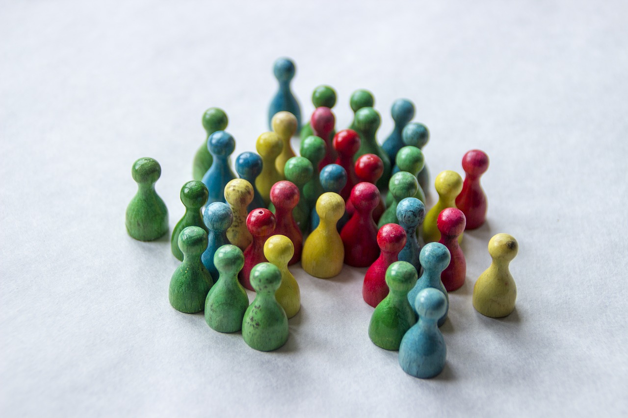 Four great ways to get more leads for your business - a crowd of green, blue, yellow and red pawns.