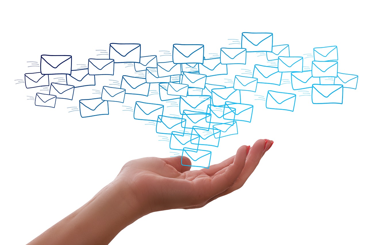 Email: the productivity killer - a cloud of envelope icons floating above a cupped hand