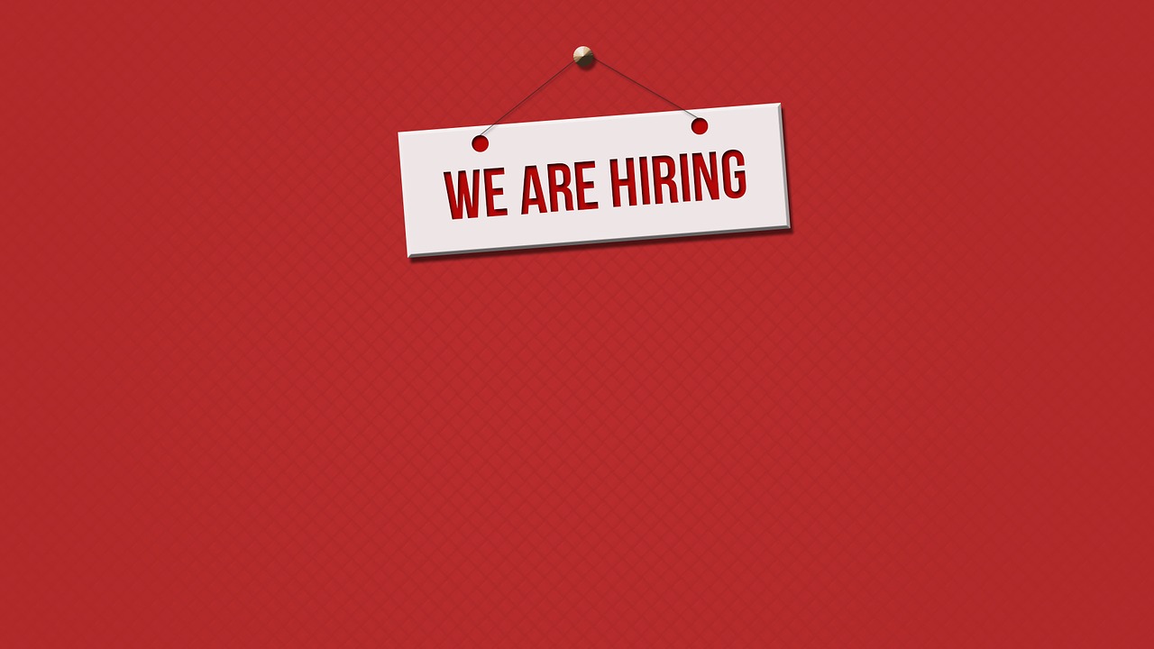 Three innovative tips for finding employees - a sign "WE ARE HIRING" on a red background