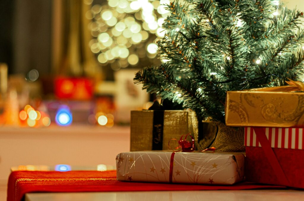 Business Update – 23 November 2023 - Christmas presents beside green christmas tree
