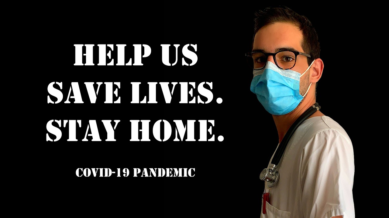 Business Update 15 July 2021 - A doctor with a face mask and the words: "Help us to save lives. Stay Home. COVID-19 pandemic