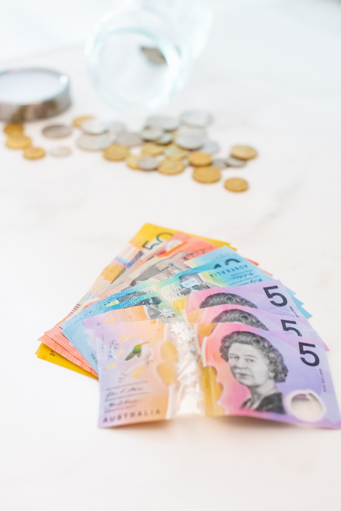 Pay yourself first – why your salary should be your business’s first monthly expense - Australian notes and coins on a white background