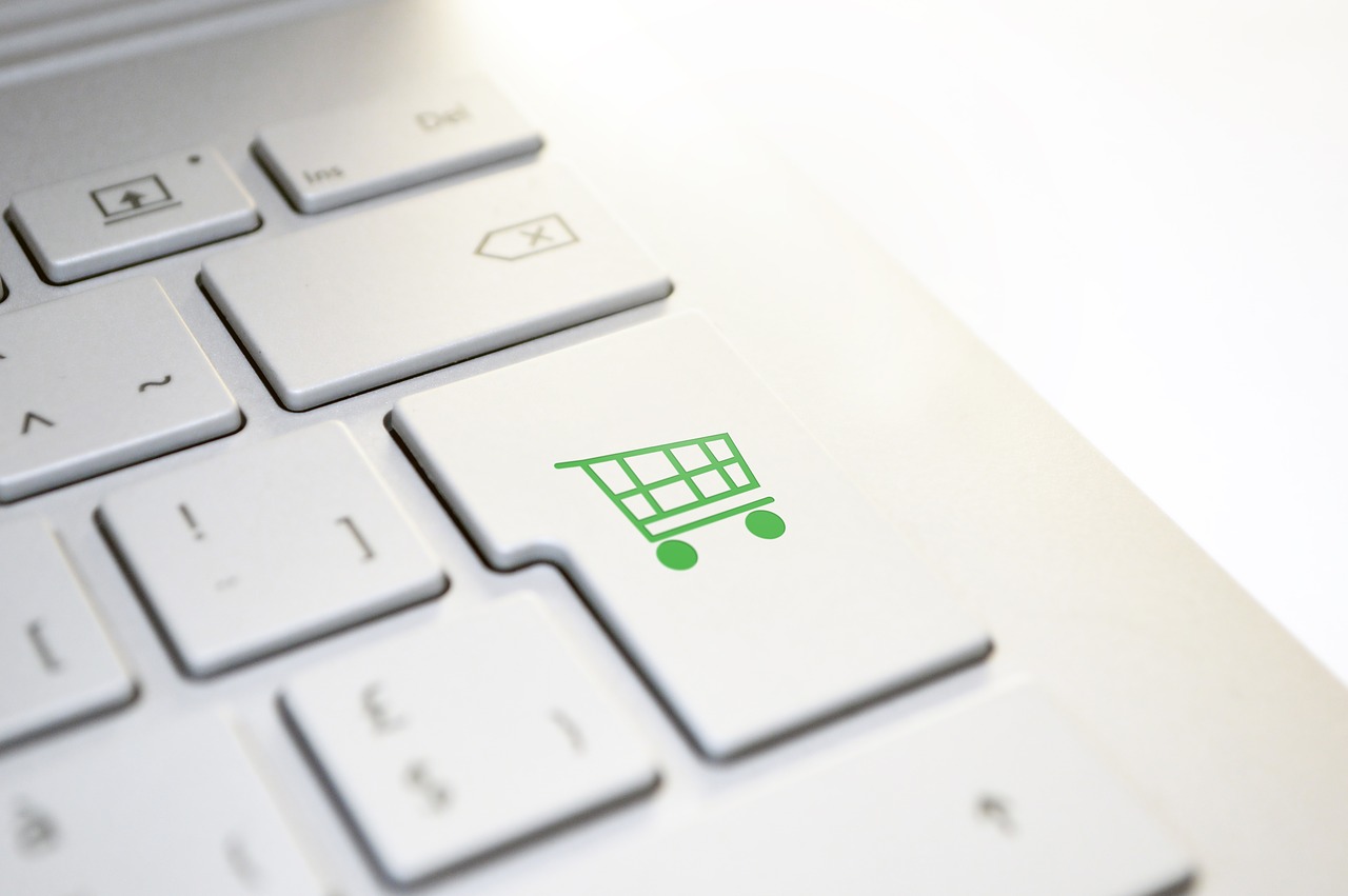How small businesses boost sales during Covid-19 - a laptop keyboard with a shopping trolley icon marking the enter key