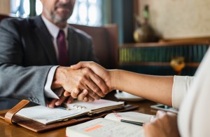 Polite ways to sack a client - professional man shaking hands with a client he is no longer serving