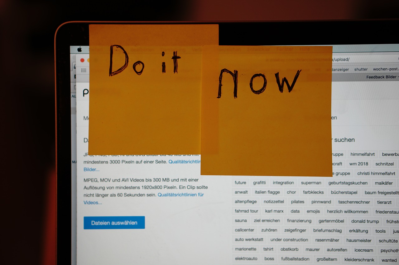 Creating your business to-do list - Sticky notes with the words "Do it Now" stuck on a computer screen